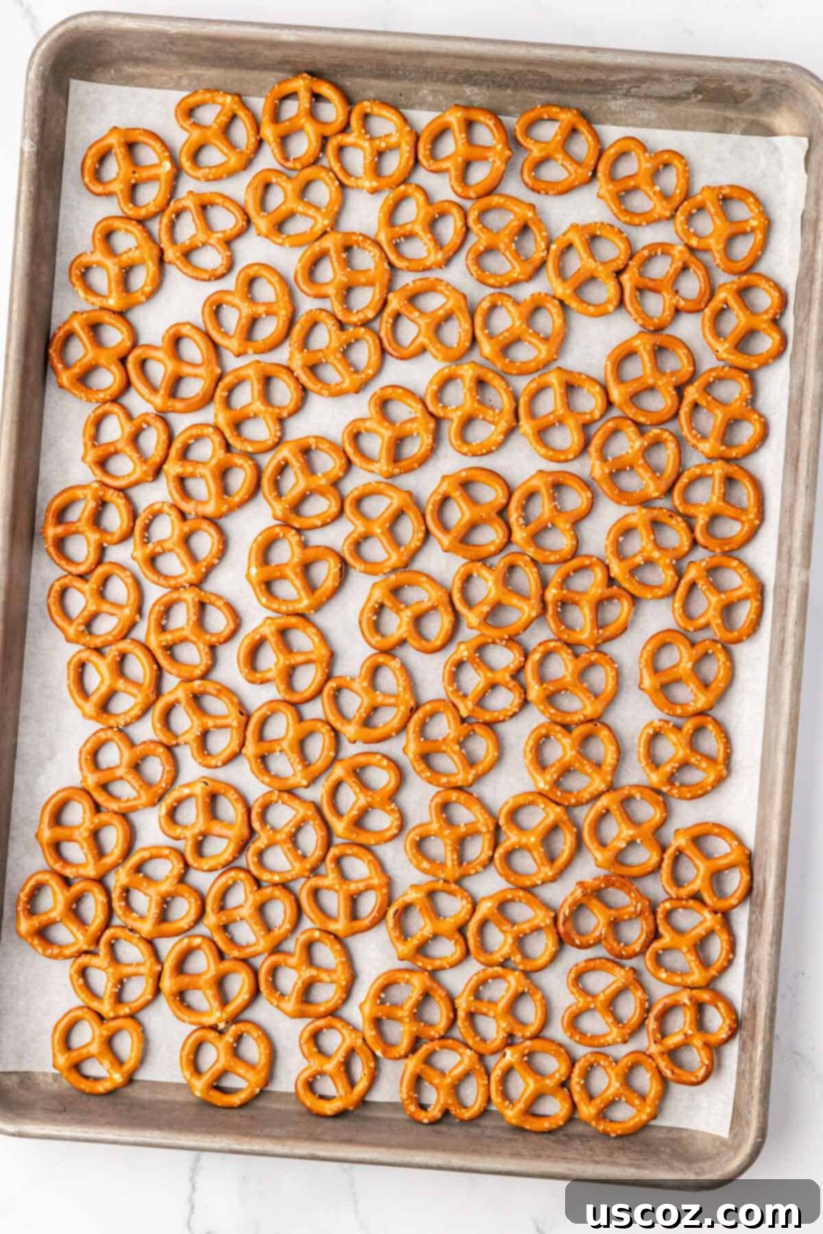 Holiday Pretzel Crunch 5 pretzels on a baking sheet