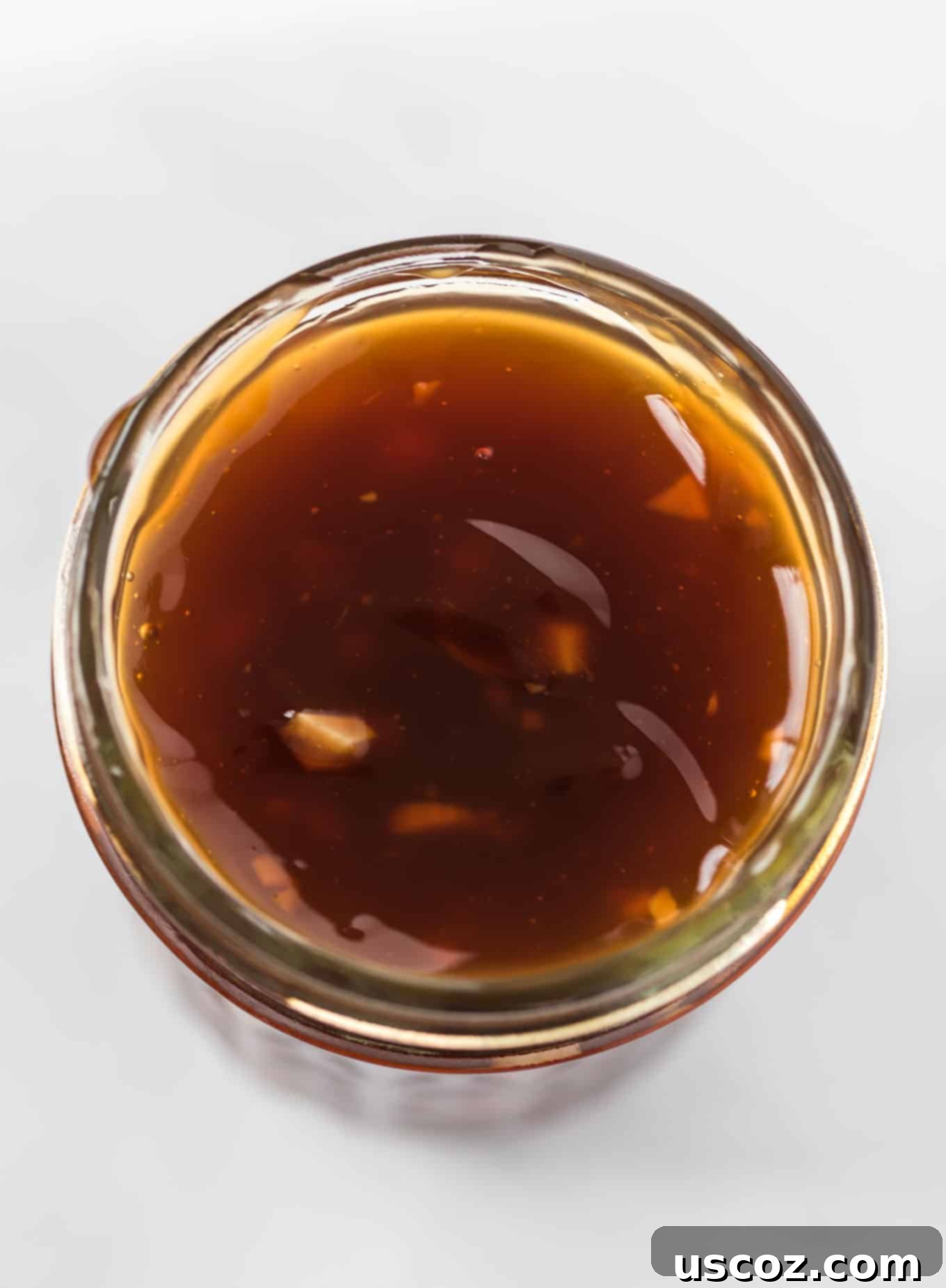 Homemade Teriyaki Sauce 10 An overhead shot of two glass jars filled with homemade teriyaki sauce, showcasing its inviting color and texture.