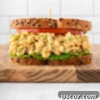 Creamy Dreamy Chickpea Salad Sandwich 13 Delicious vegan chickpea salad sandwich on bread with tomato and lettuce