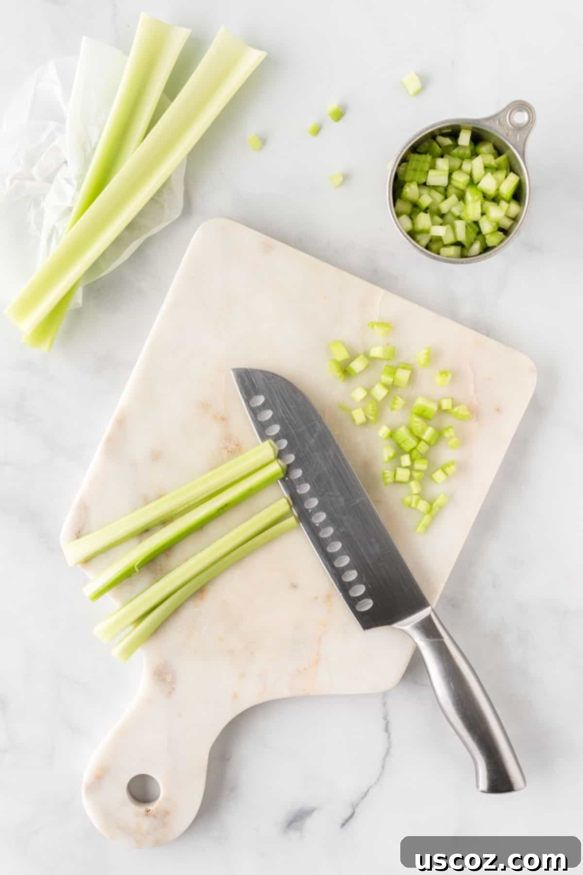 Creamy Dreamy Chickpea Salad Sandwich 4 Hands dicing fresh celery into small pieces for the chickpea salad