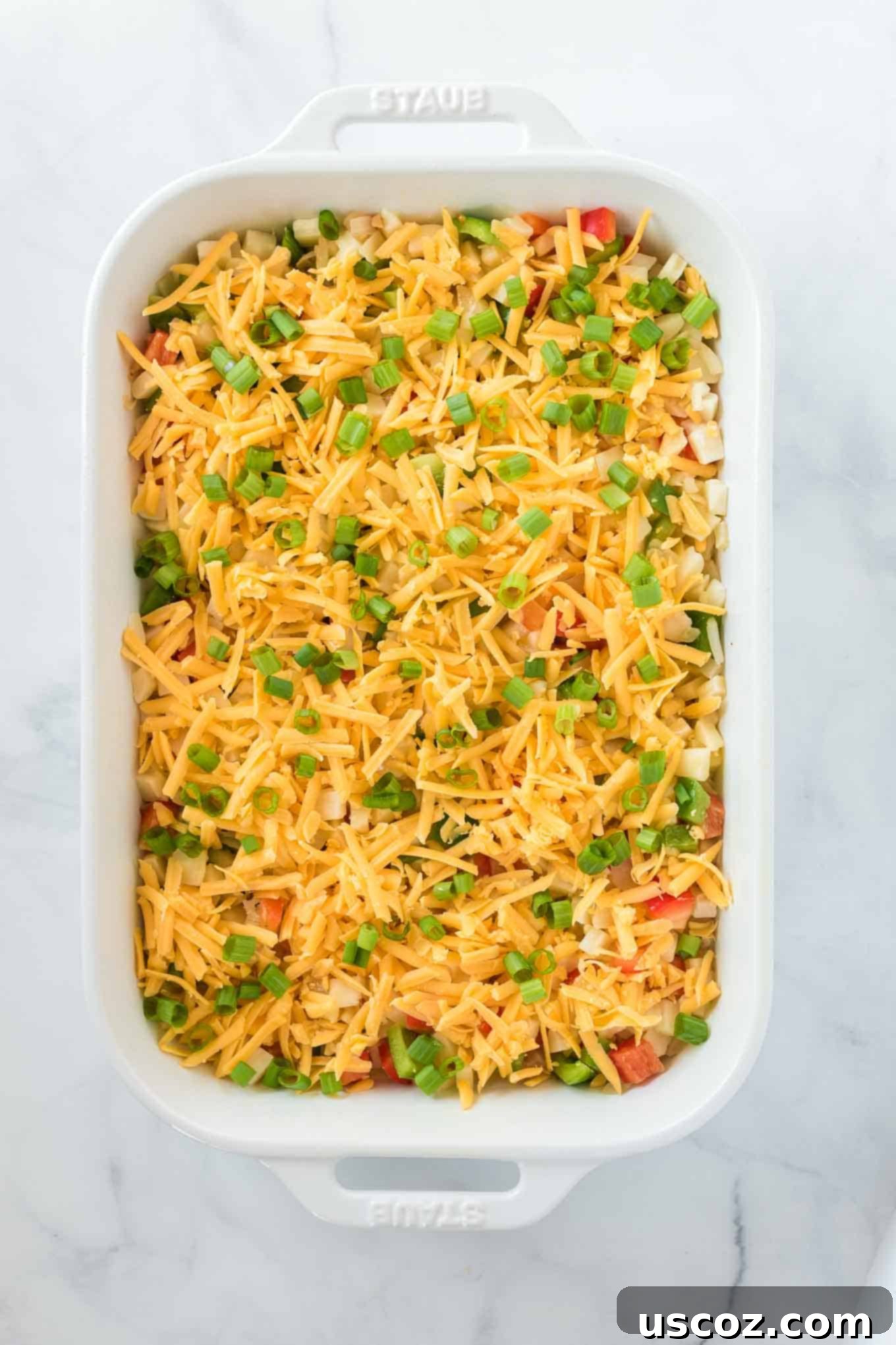 Golden Hash Brown Egg Bake 8 casserole topped with sharp cheddar cheese and green onions