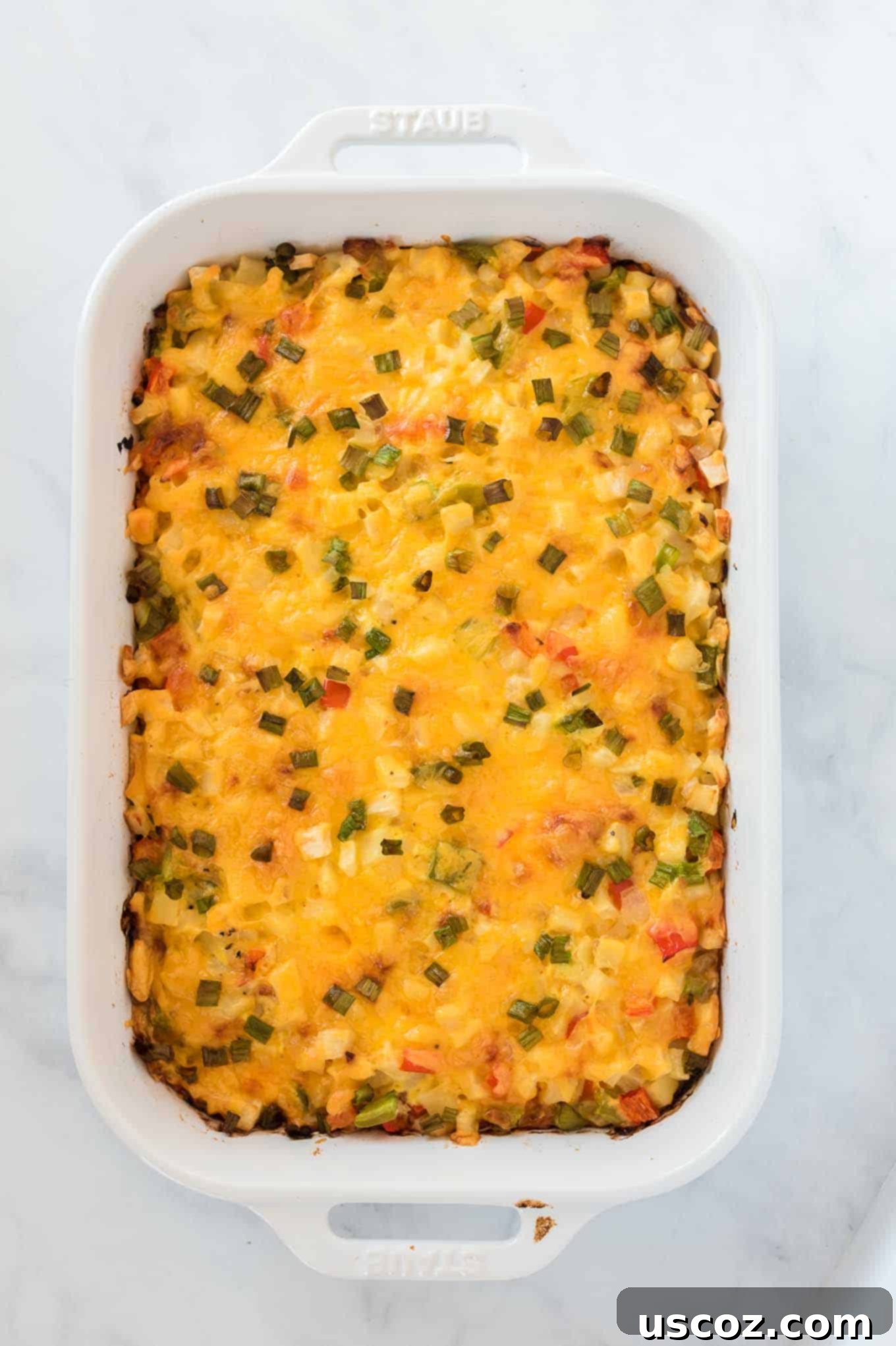 Golden Hash Brown Egg Bake 9 finished baked hash brown egg casserole in a white dish