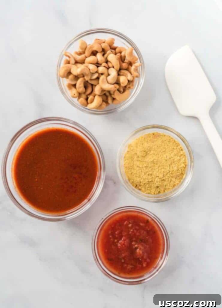 Creamy Plant-Based Queso 4 the ingredients in separate glass bowls (cashews, nutritional yeast, salsa, and enchilada sauce)