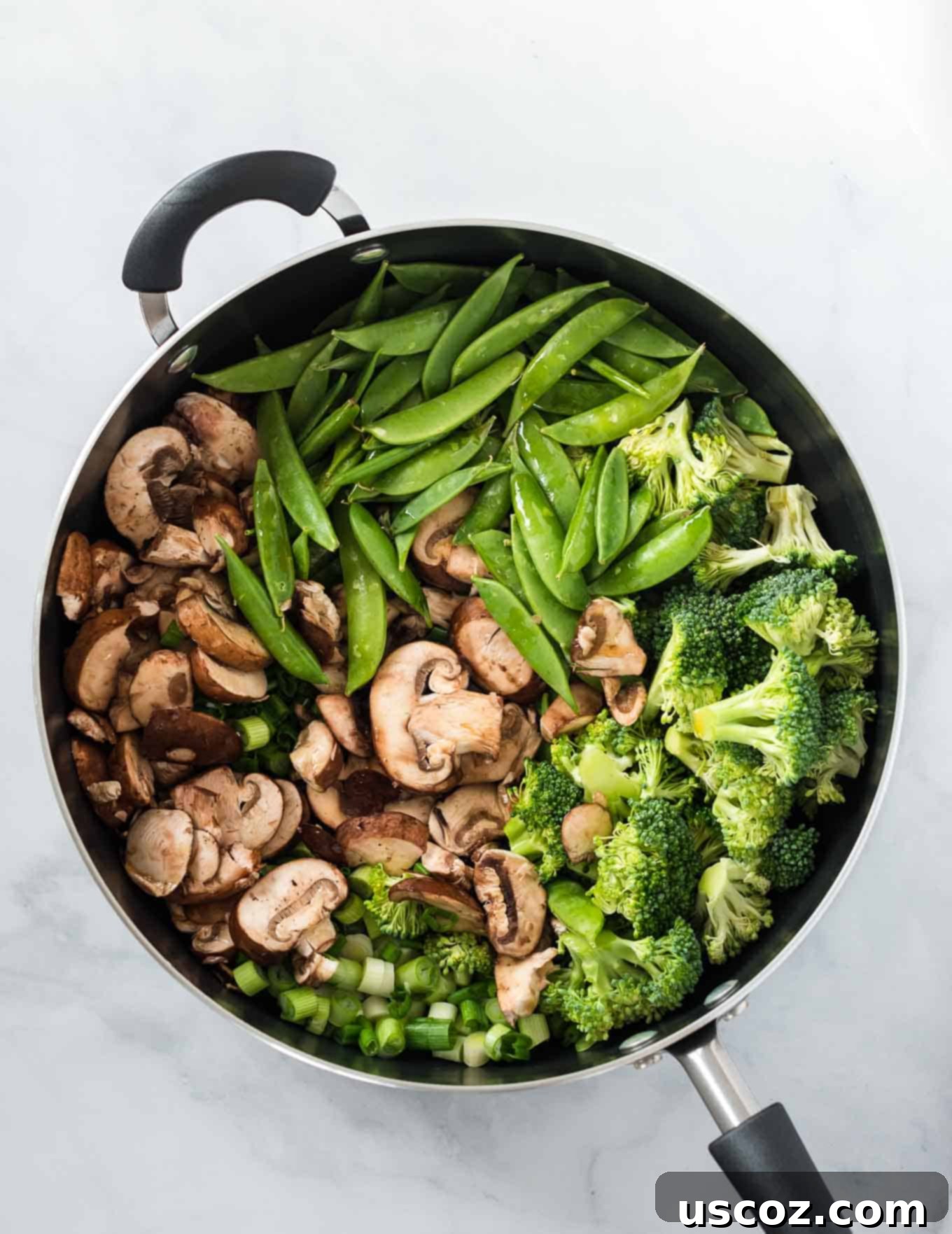 Sweet & Savory Teriyaki Noodles 3 mushrooms, sugar snap peas, broccoli, and green onions in a large skillet