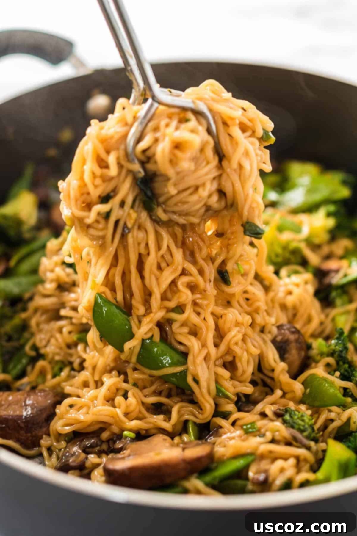 Sweet & Savory Teriyaki Noodles 7 grabbing a serving of teriyaki noodles