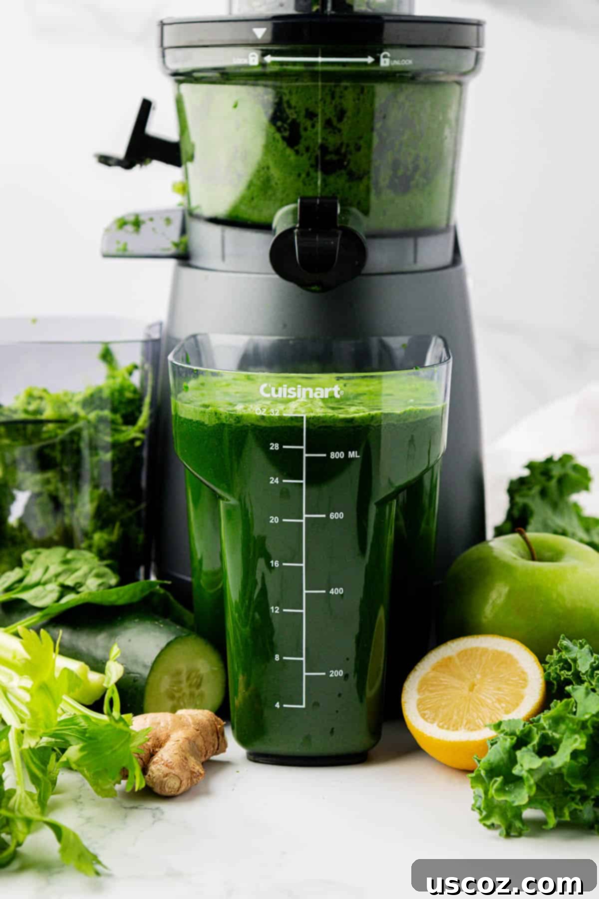 Your Daily Green Boost 3 green juice next to a juicer