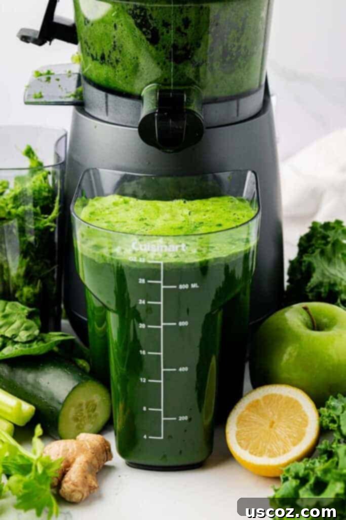 Your Daily Green Boost 6 green juice next to a juicer