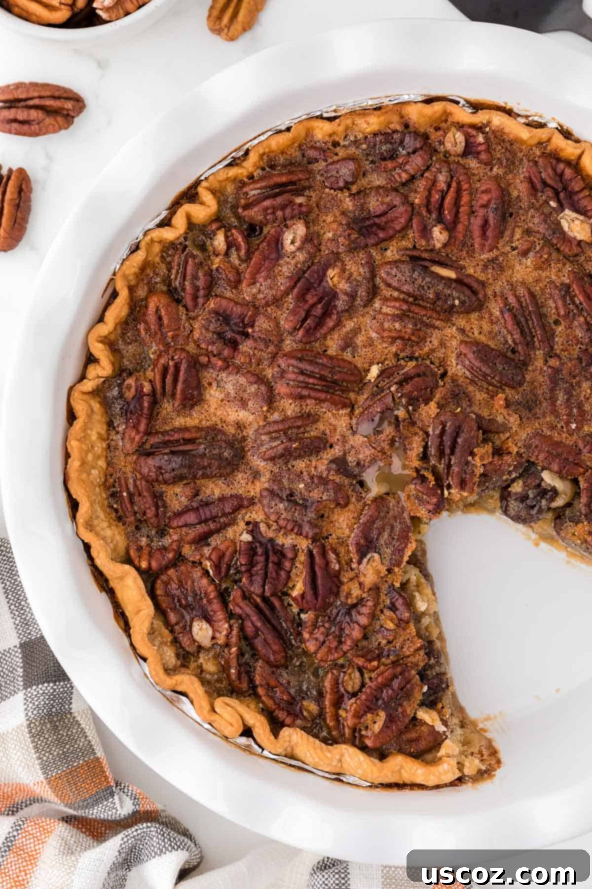 Sweet Maple Pecan Perfection 8 pecan pie with a slice taken out