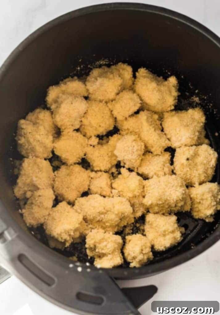 Crispy Air Fryer Tofu Nuggets 7 breaded tofu nuggets in the air fryer basket
