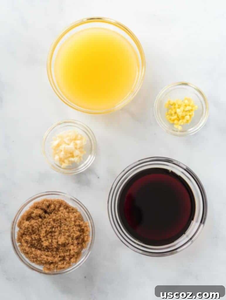 Sticky Teriyaki Cauliflower Bites 10 Five small glass bowls filled with individual teriyaki sauce ingredients: orange juice, minced garlic, grated ginger, brown sugar, and soy sauce.