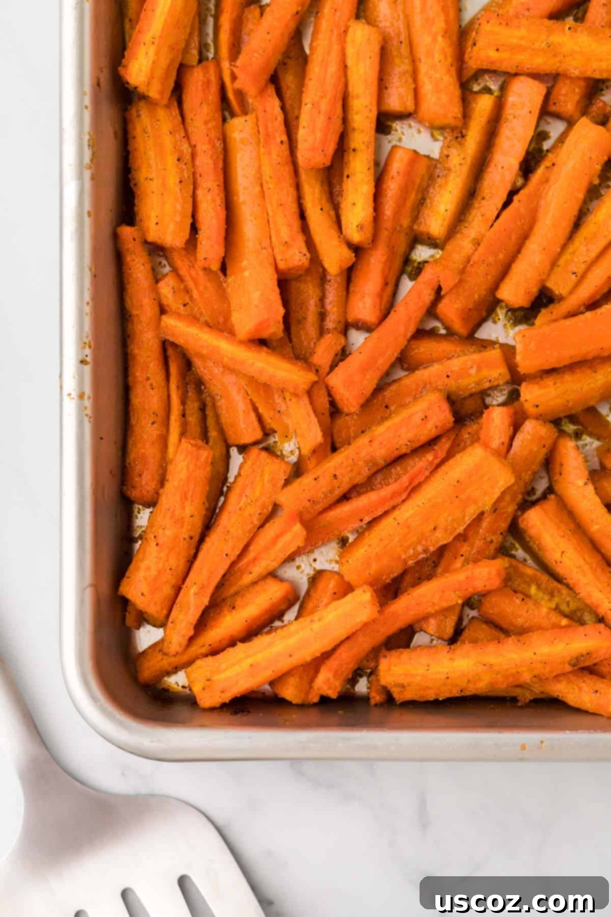 The Ultimate Roasted Carrots 10 roasted carrots on the baking sheet