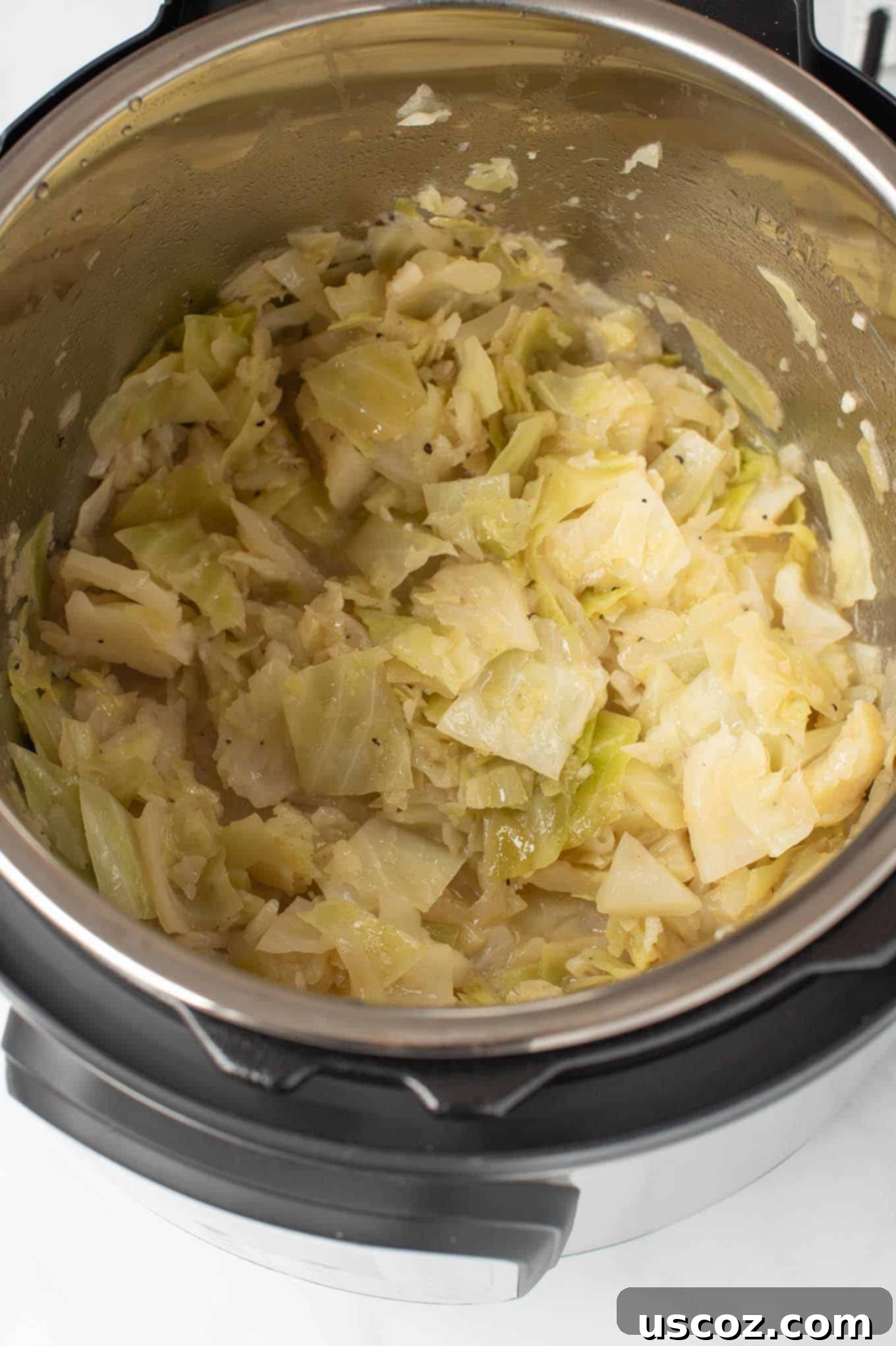 Savory Instant Pot Cabbage 4 Cooked buttered cabbage being scooped from the Instant Pot