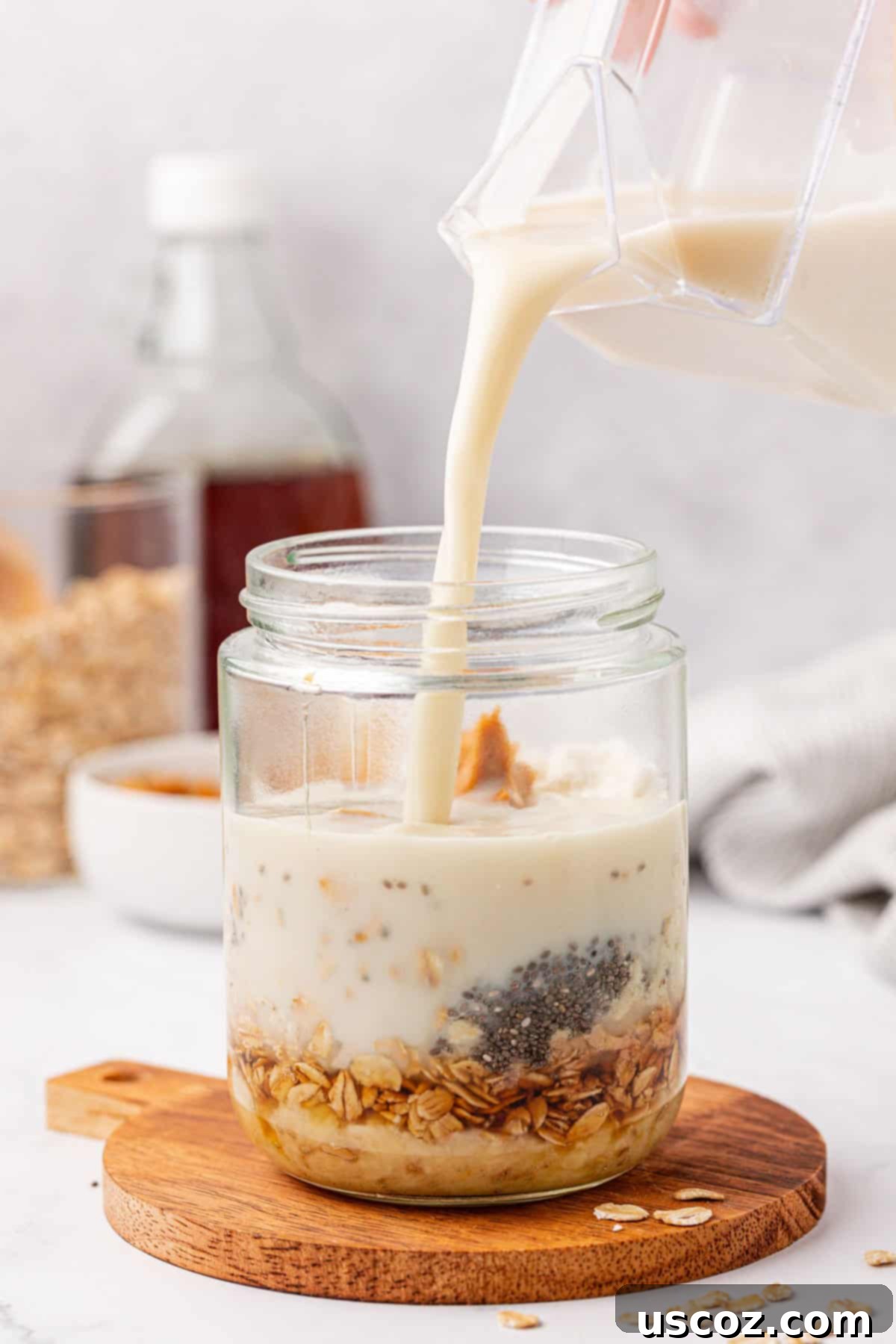 Power-Packed Overnight Oats 10 pouring milk into the jar