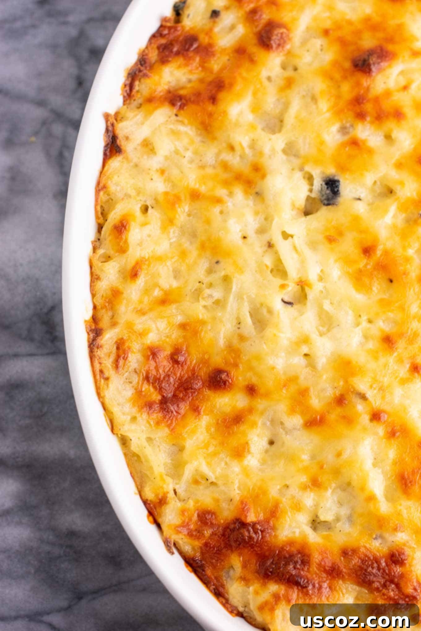 Hearty Hash Brown Bake 4 Vegetarian Hash Brown Casserole ingredients mixed in a bowl