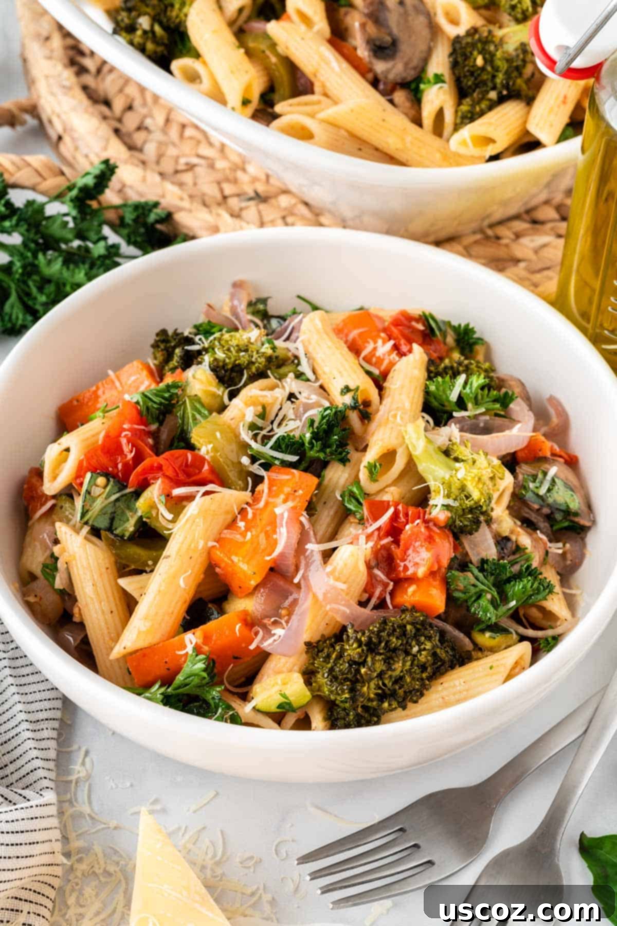 Hearty Roasted Veggie Pasta 13 roasted veggie pasta in a bowl topped with parmesan cheese
