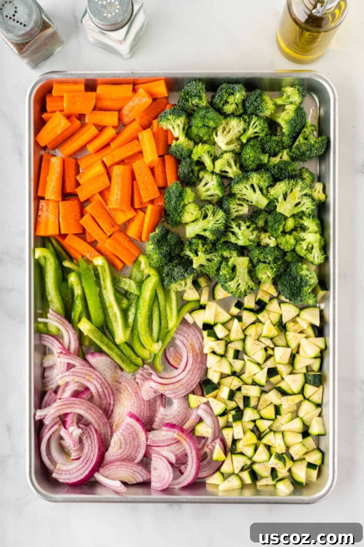 Hearty Roasted Veggie Pasta 5 carrots, broccoli, bell peppers, onion, and zucchini on a baking sheet