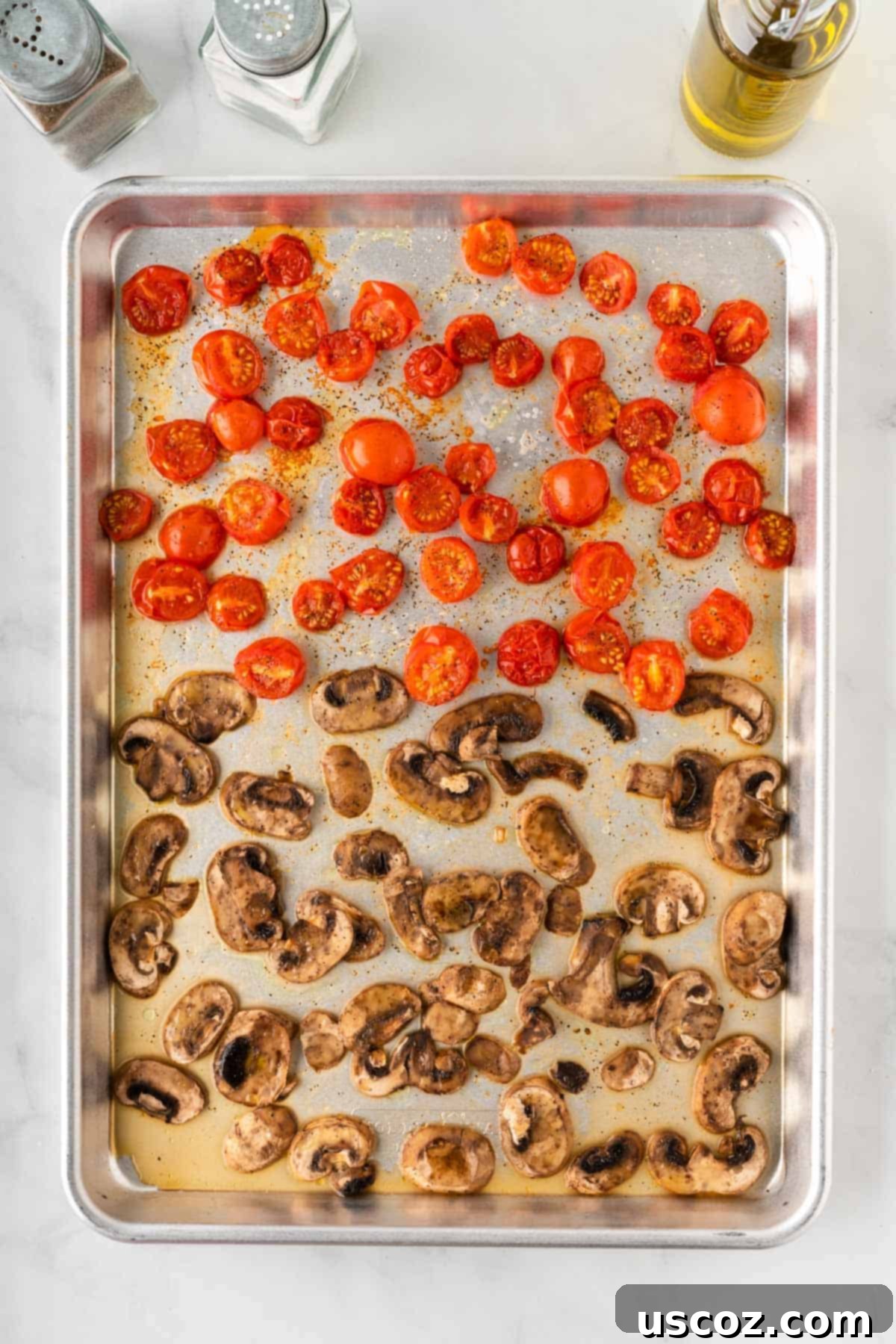 Hearty Roasted Veggie Pasta 8 roasted mushrooms and tomatoes on a baking sheet