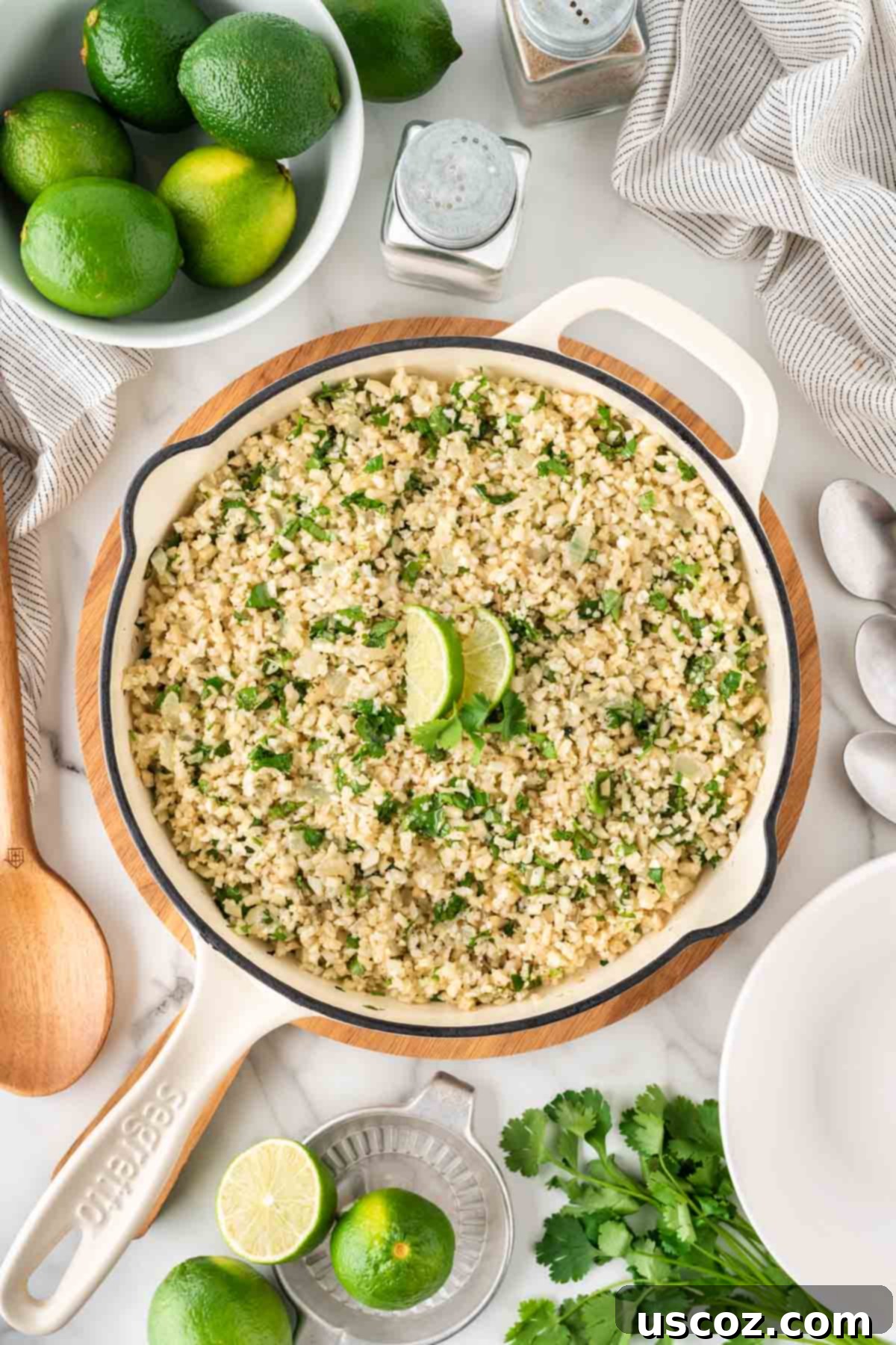 Zesty Cilantro Lime Cauliflower Rice 2 Fresh cilantro lime cauliflower rice simmering in a skillet, ready to be served as a healthy side dish or burrito bowl base.