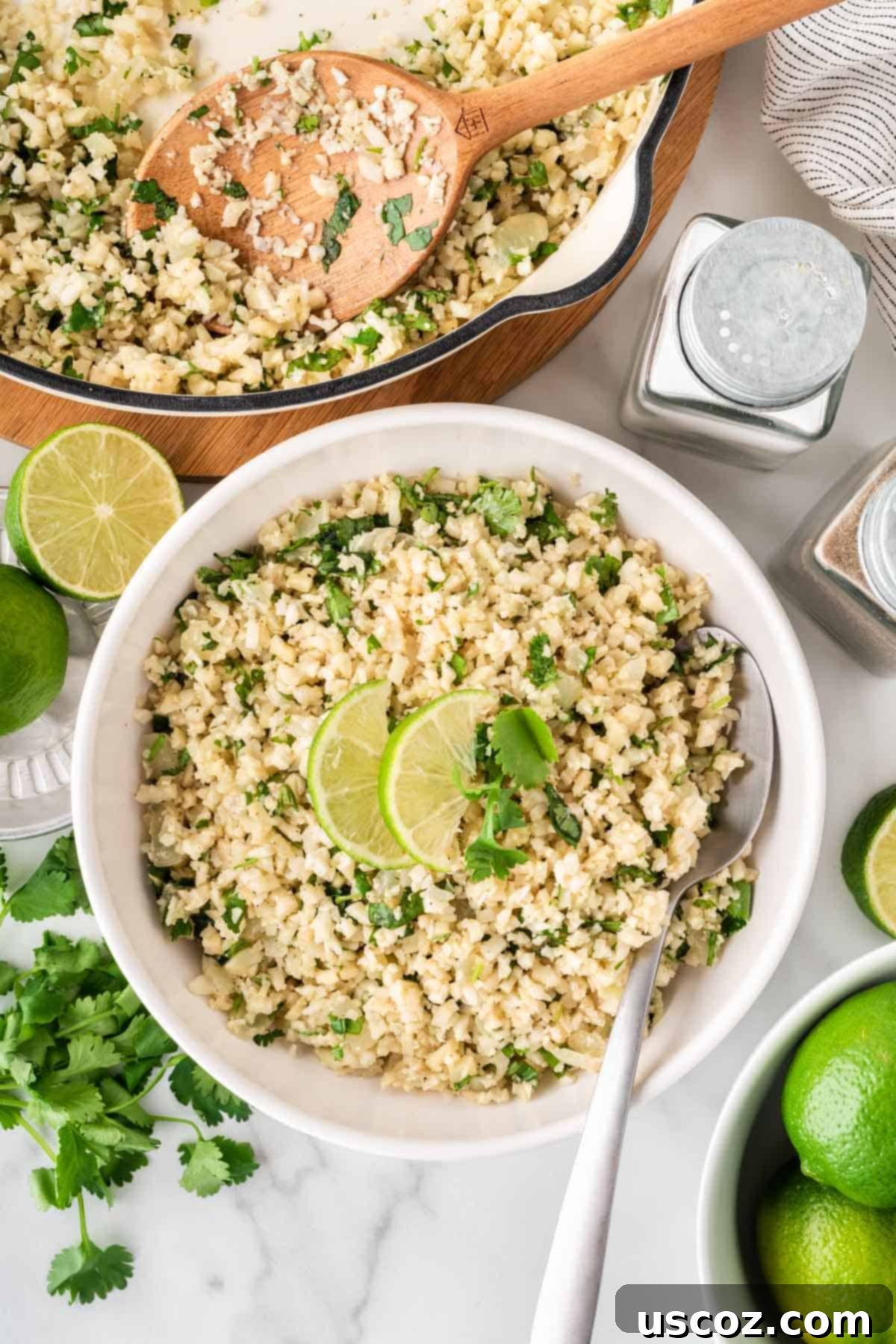 Zesty Cilantro Lime Cauliflower Rice 13 Fluffy cilantro lime cauliflower rice served in a rustic serving bowl, garnished with fresh cilantro sprigs.