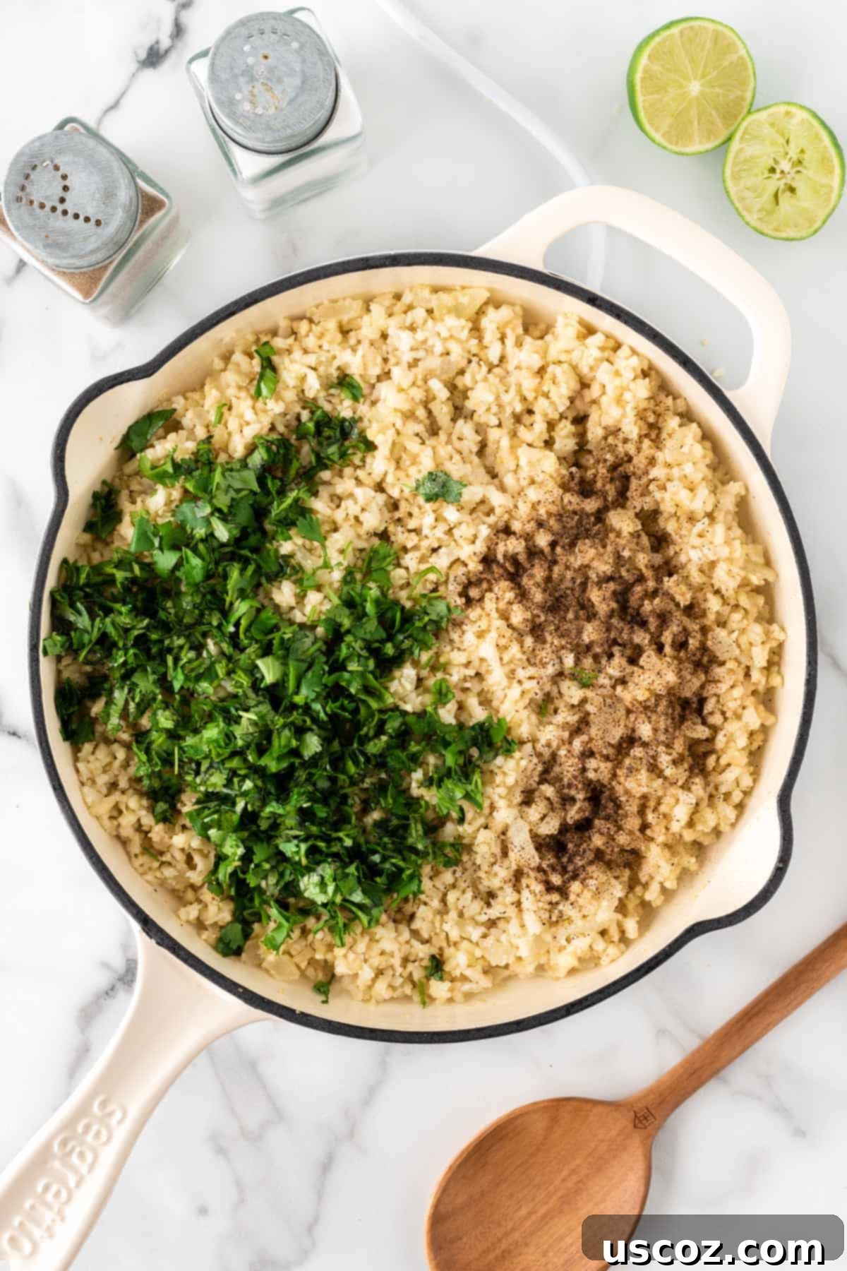 Zesty Cilantro Lime Cauliflower Rice 9 Adding fresh chopped cilantro, lime juice, salt, and pepper to the cooked cauliflower rice in a skillet.