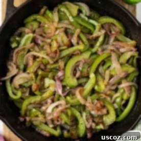 Sizzling Fajita Vegetables 12 fajita veggies in a skillet, showcasing their delicious readiness
