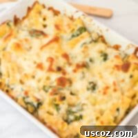 Creamy Spinach Artichoke Pasta Casserole 10 Spinach artichoke pasta bake in a white baking dish, ready to be served