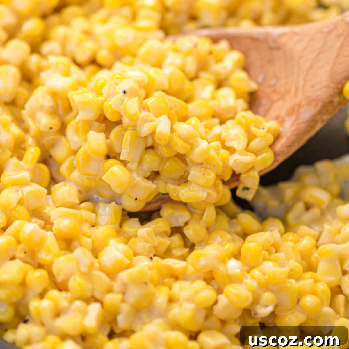 Sweet and Buttery Skillet Corn 2 honey butter skillet corn on a wooden spoon