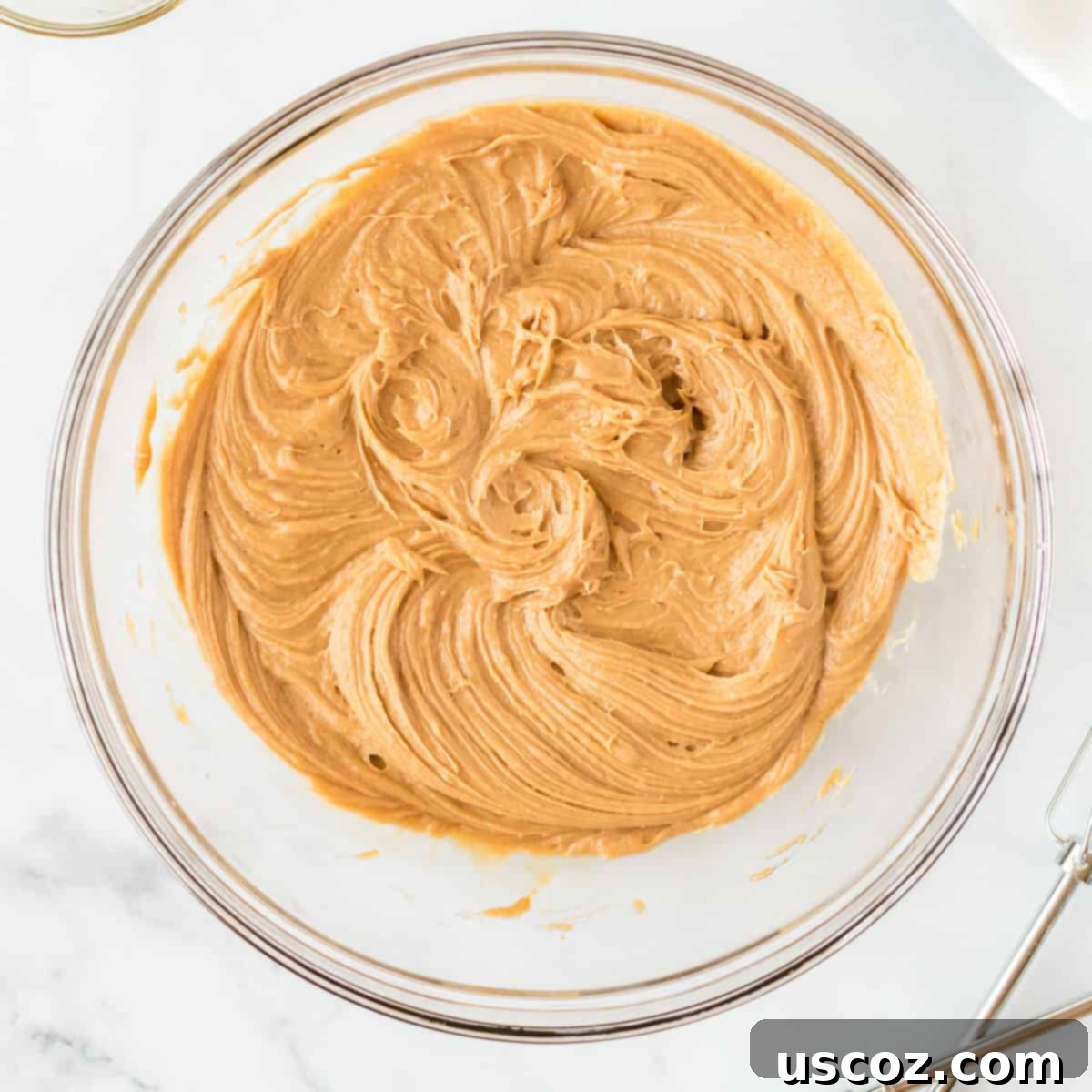 Irresistible Gluten-Free Monster Cookies 6 The smooth, creamy peanut butter mixture is thoroughly combined, creating a perfect base for the monster cookies.