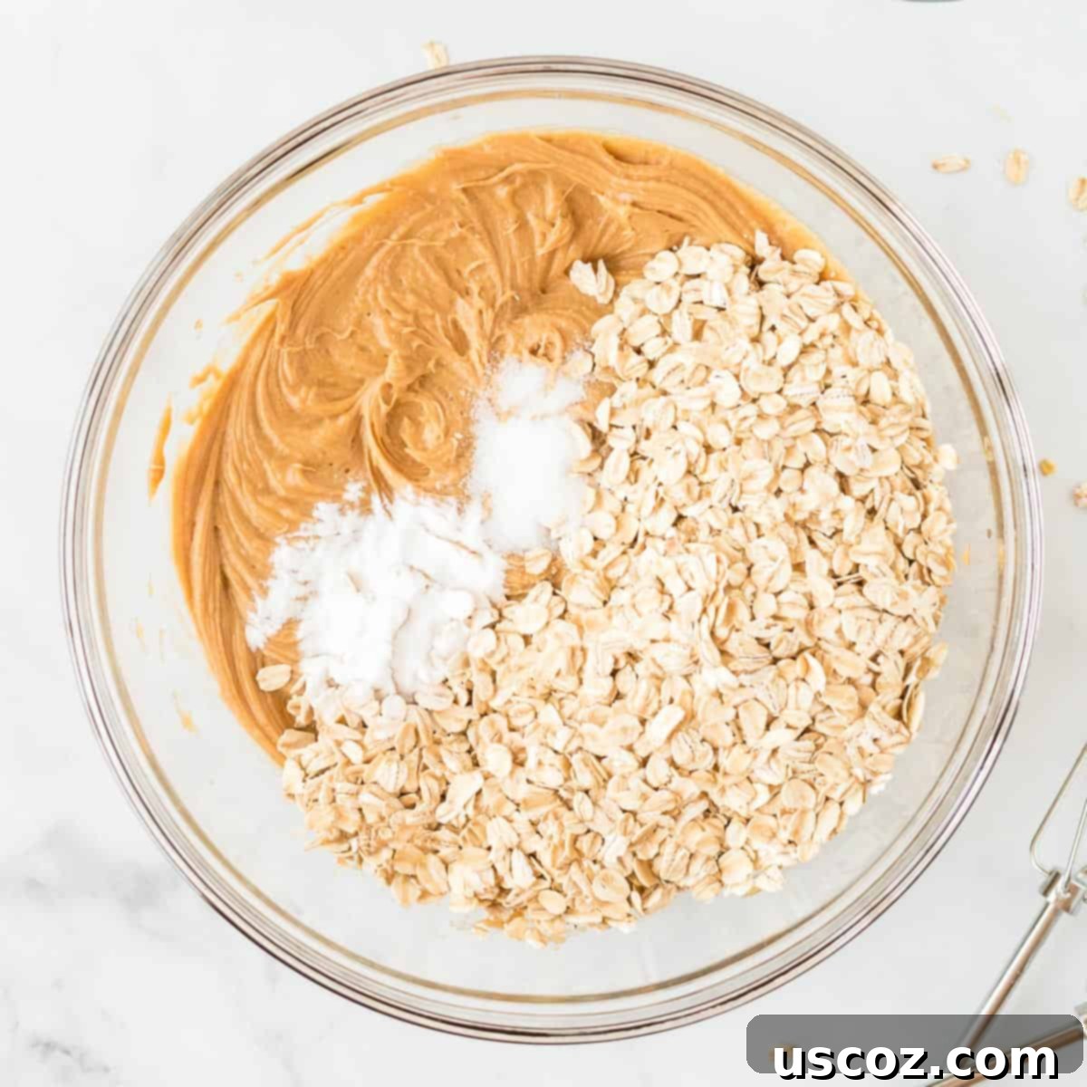 Irresistible Gluten-Free Monster Cookies 7 Gluten-free rolled oats and baking soda are added to the wet peanut butter cookie batter.