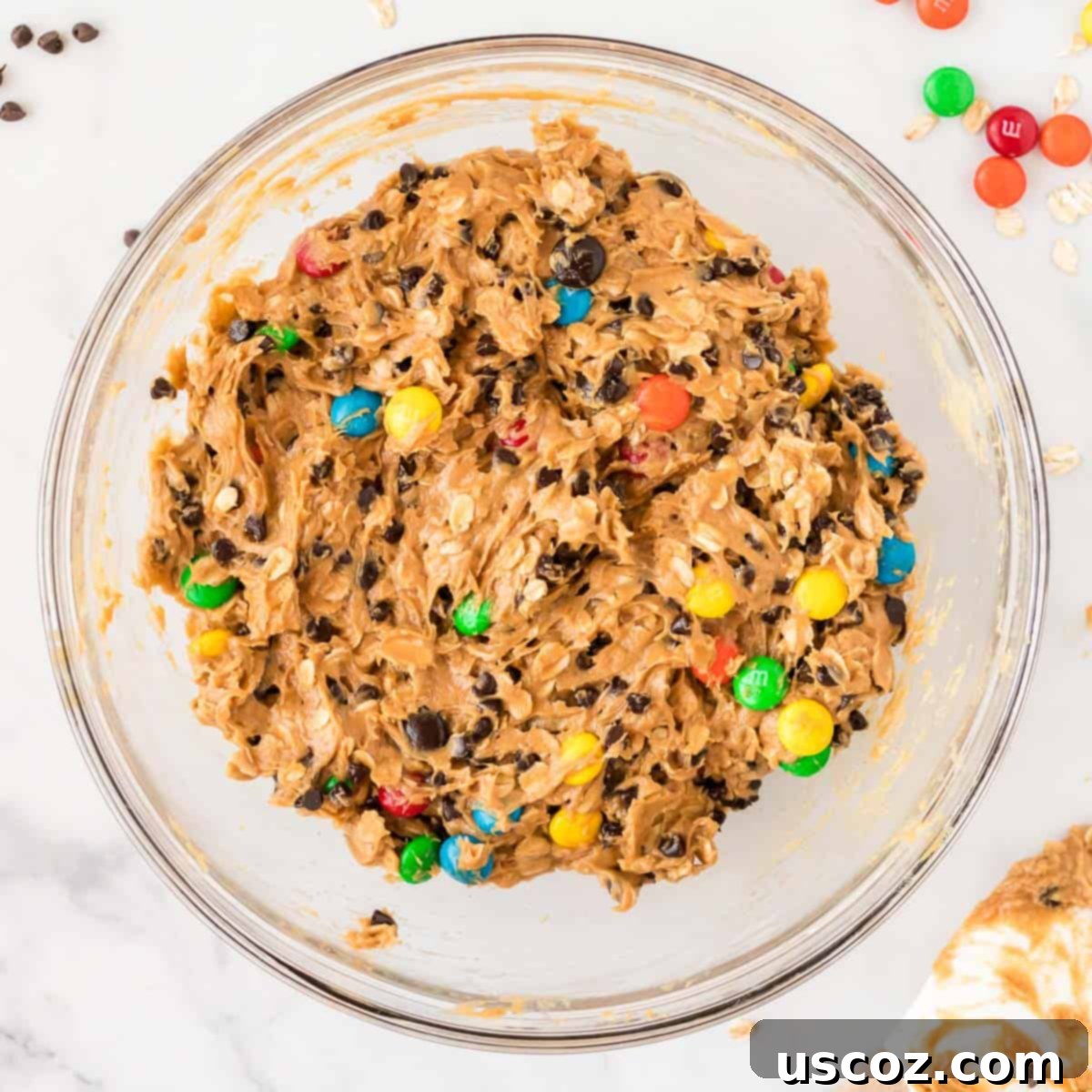 Irresistible Gluten-Free Monster Cookies 10 The fully mixed gluten-free monster cookie batter, laden with chocolate chips and M&M's, ready for baking.