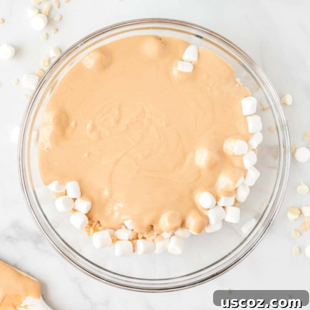 Summit Cookies 9 melted white chocolate poured over the mini marshmallows and rice krispies