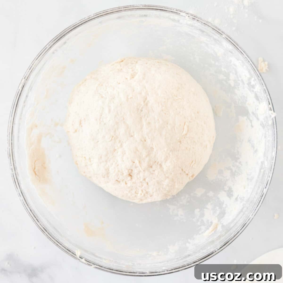 Effortless Cinnamon Swirls 5 perfectly formed dough ball in a mixing bowl