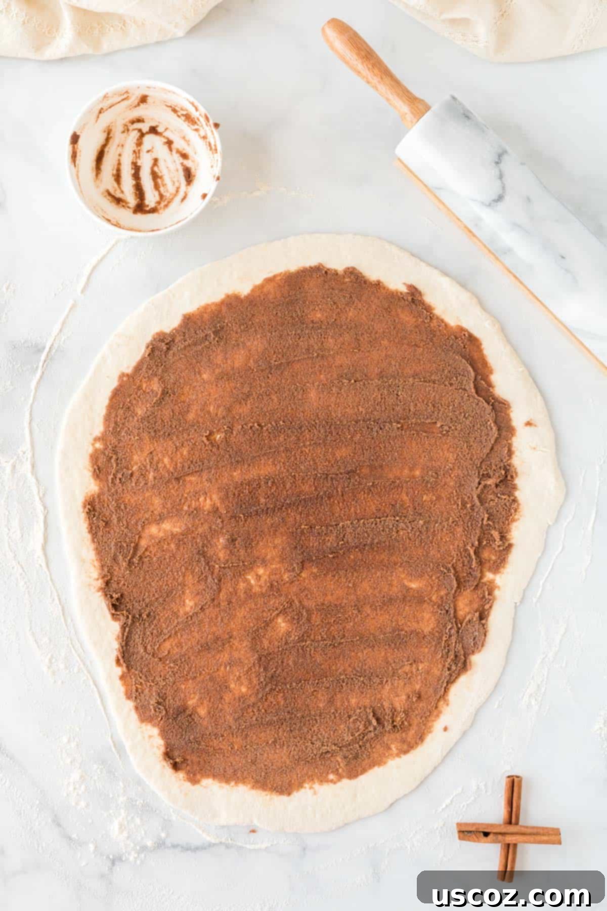 Effortless Cinnamon Swirls 8 dough rolled out and generously covered with cinnamon sugar filling
