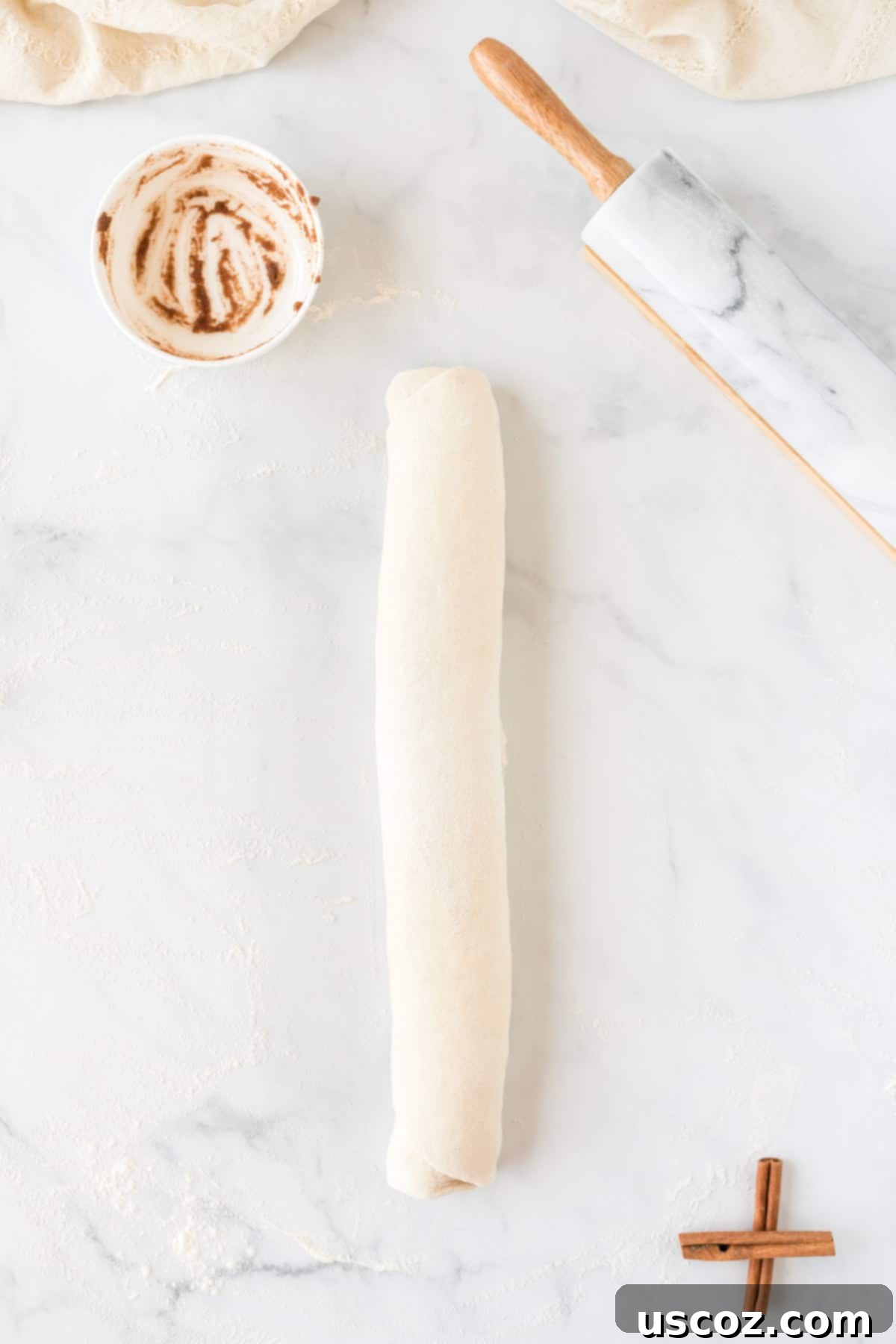 Effortless Cinnamon Swirls 9 cinnamon roll dough expertly rolled into a log shape