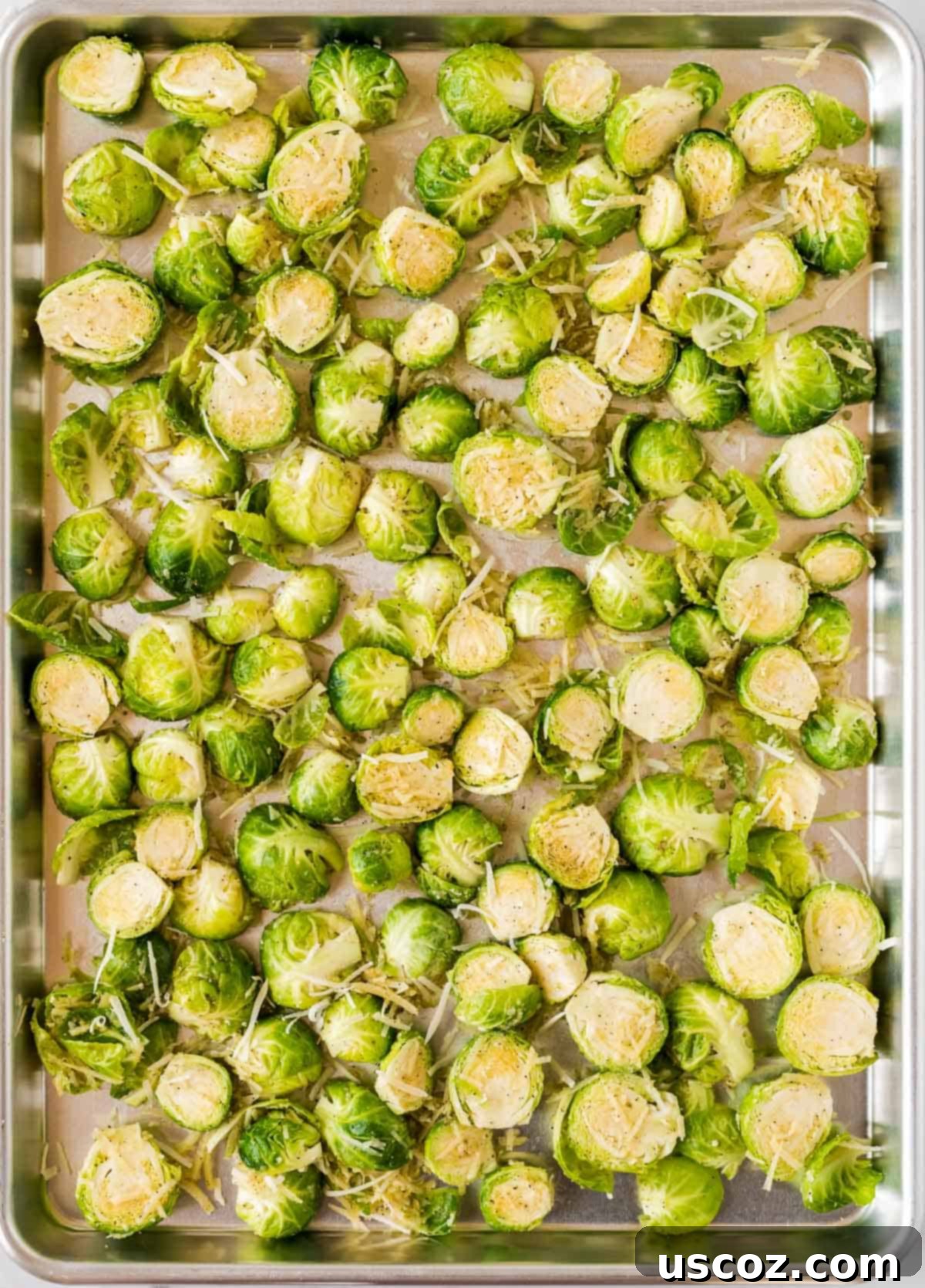 Parmesan Roasted Brussels Sprouts 8 brussels sprouts spread on a baking sheet before roasting