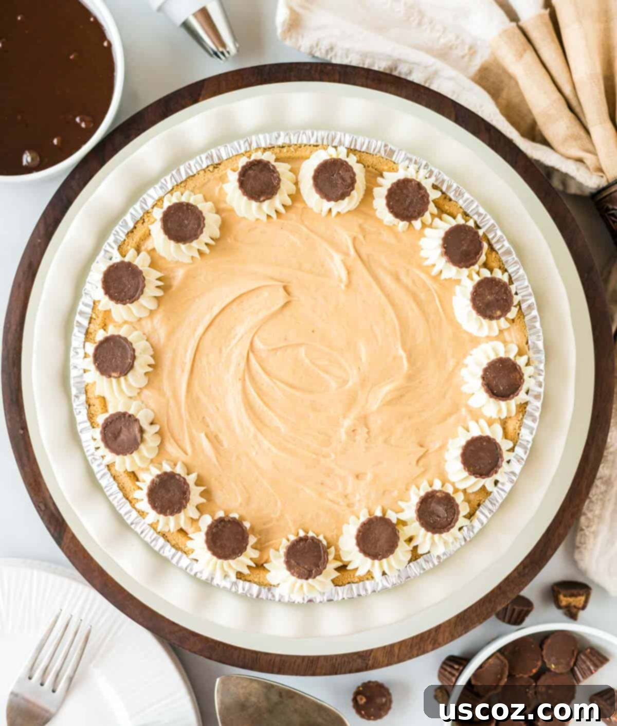 Simple No-Bake Peanut Butter Delight 12 A beautifully decorated no-bake peanut butter pie topped with generous swirls of whipped cream and Reese's peanut butter cups.
