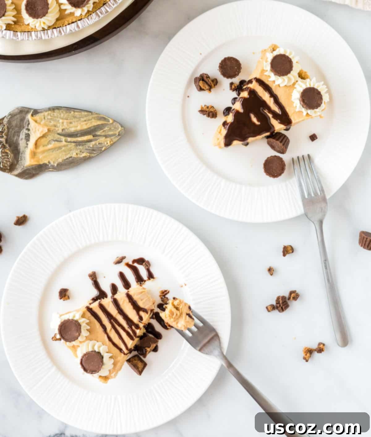 Simple No-Bake Peanut Butter Delight 16 Two plates, each holding a generous slice of no-bake peanut butter pie, with a decadent chocolate drizzle.