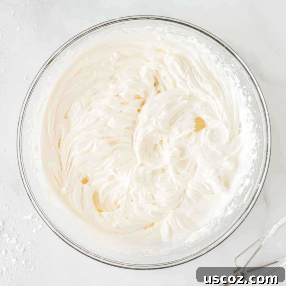 Simple No-Bake Peanut Butter Delight 6 Freshly made, fluffy homemade whipped cream in a mixing bowl.