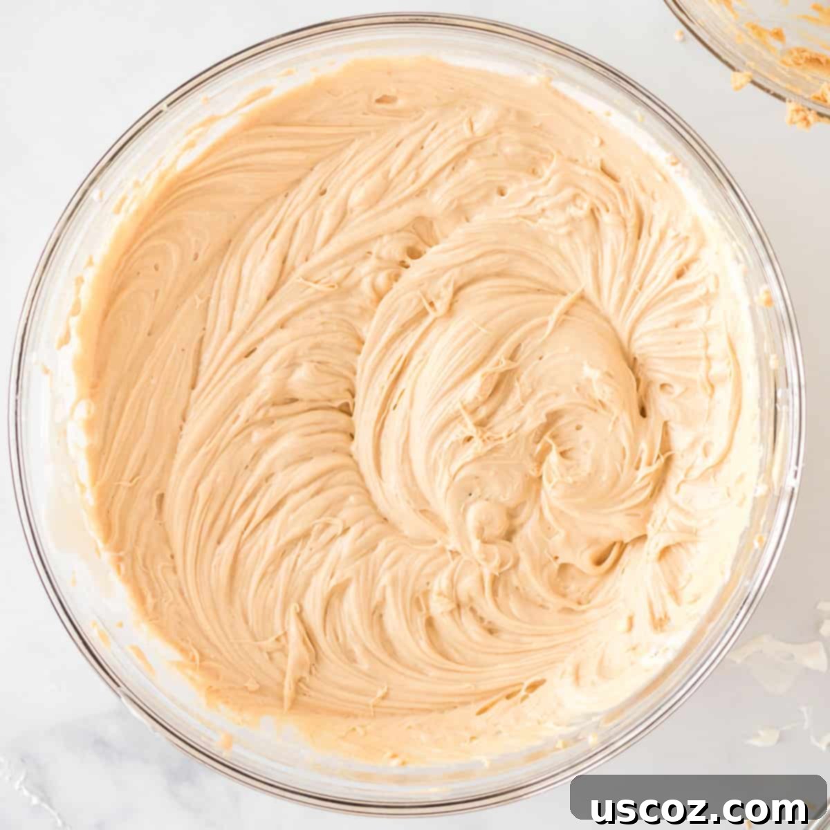 Simple No-Bake Peanut Butter Delight 9 The fully mixed, smooth, and creamy no-bake peanut butter pie filling in a bowl.