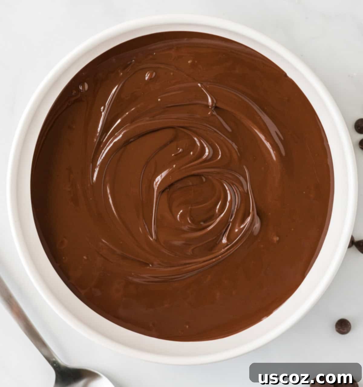 Irresistible Ritz Cookie Bites 10 A bowl of perfectly melted chocolate, ready for dipping.