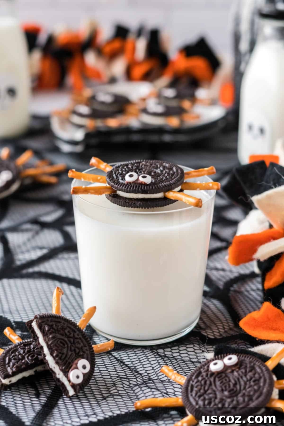 Eight-Legged Oreo Delights 2 A delicious Oreo spider with pretzel legs and googly eyes, resting on a glass of milk, ready to be enjoyed as a Halloween treat.