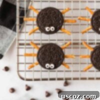 Eight-Legged Oreo Delights 16 A close-up of an adorable Oreo spider cookie with pretzel legs and googly eyes, a fun Halloween treat.