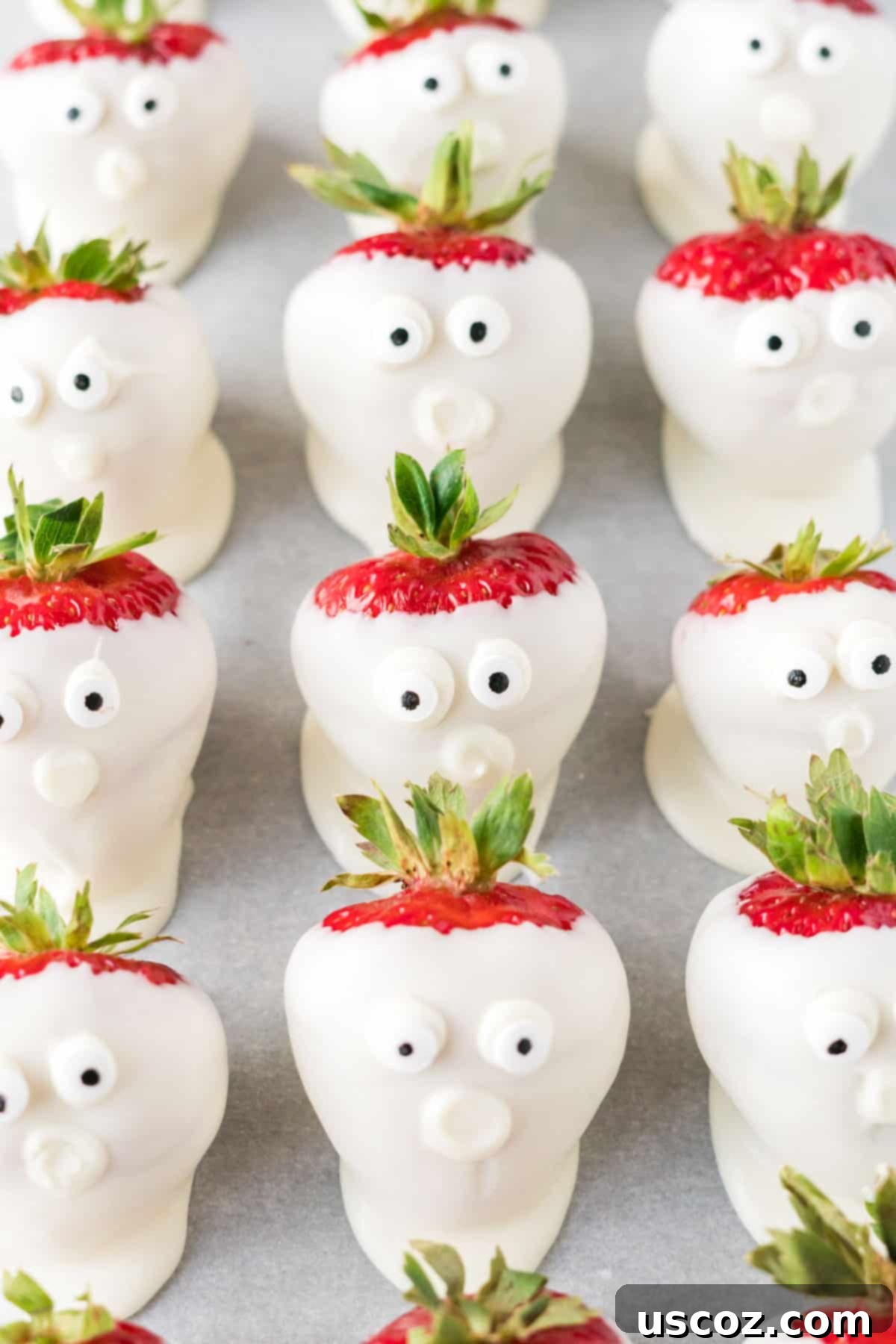 Strawberry Whispers 2 strawberry ghosts with googly eye candy