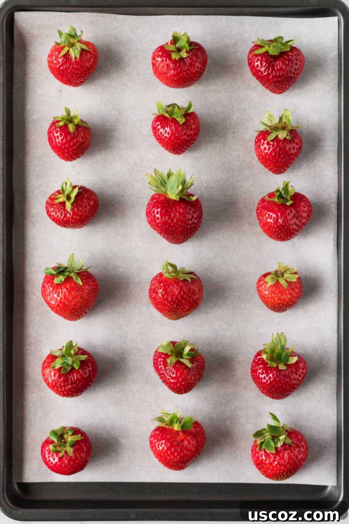 Strawberry Whispers 9 strawberries on a parchment paper lined baking sheet