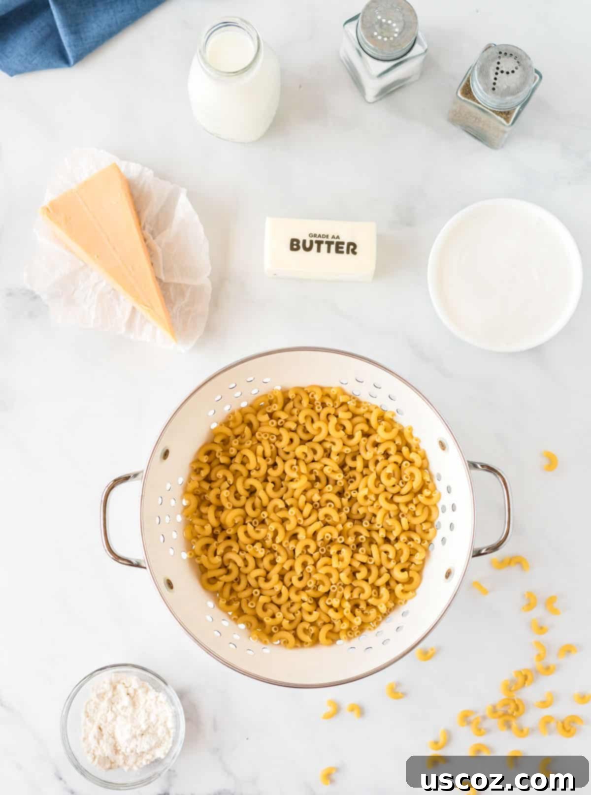 Creamy Greek Yogurt Mac and Cheese 4 ingredients needed to make mac and cheese with greek yogurt arranged on a counter