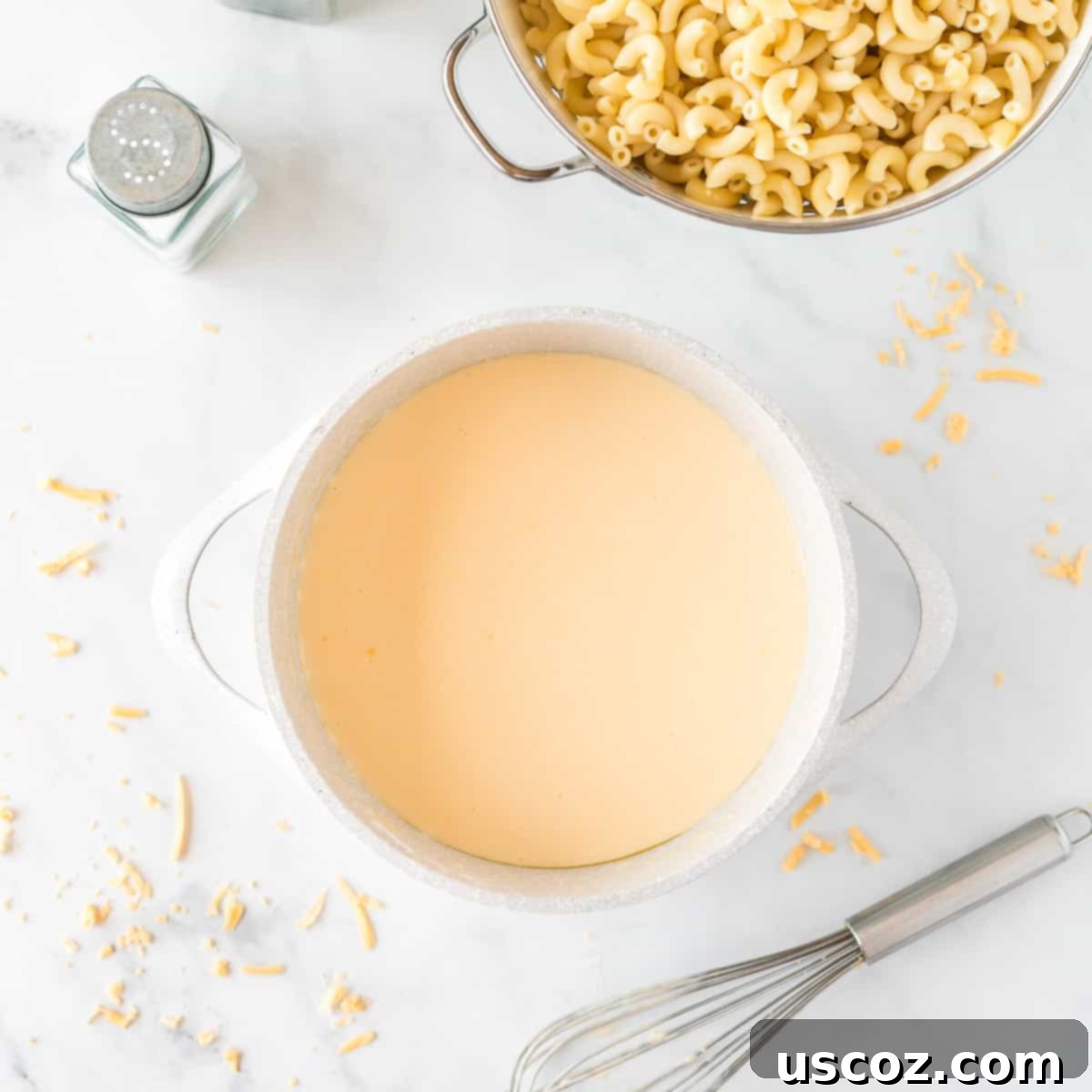 Creamy Greek Yogurt Mac and Cheese 6 cheese sauce being made in a pot next to cooked macaroni noodles