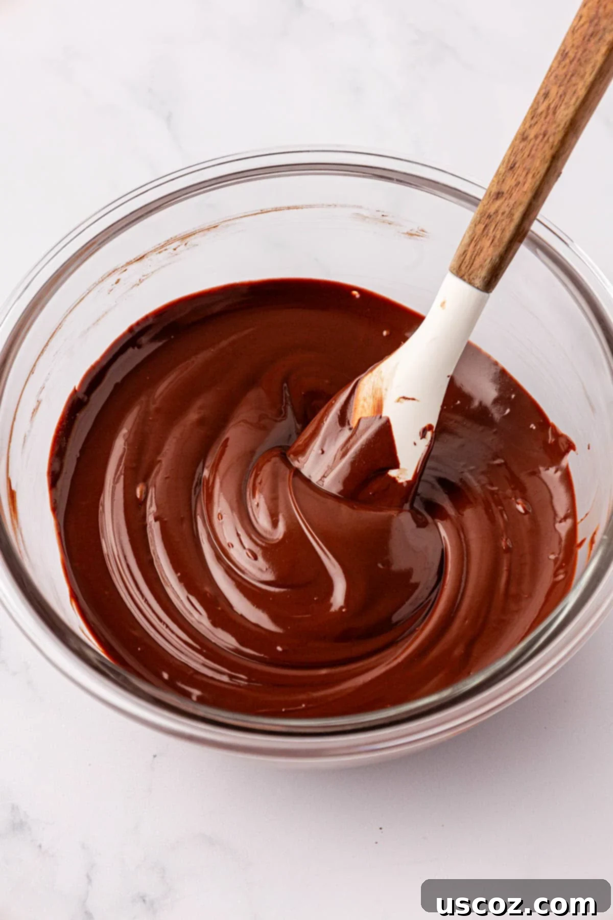 Effortless Protein Bars 12 melted chocolate in a mixing bowl