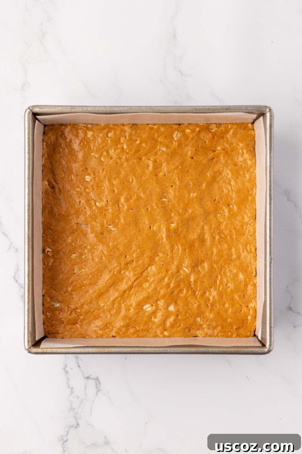 Effortless Protein Bars 10 protein bar batter pressed into a baking dish
