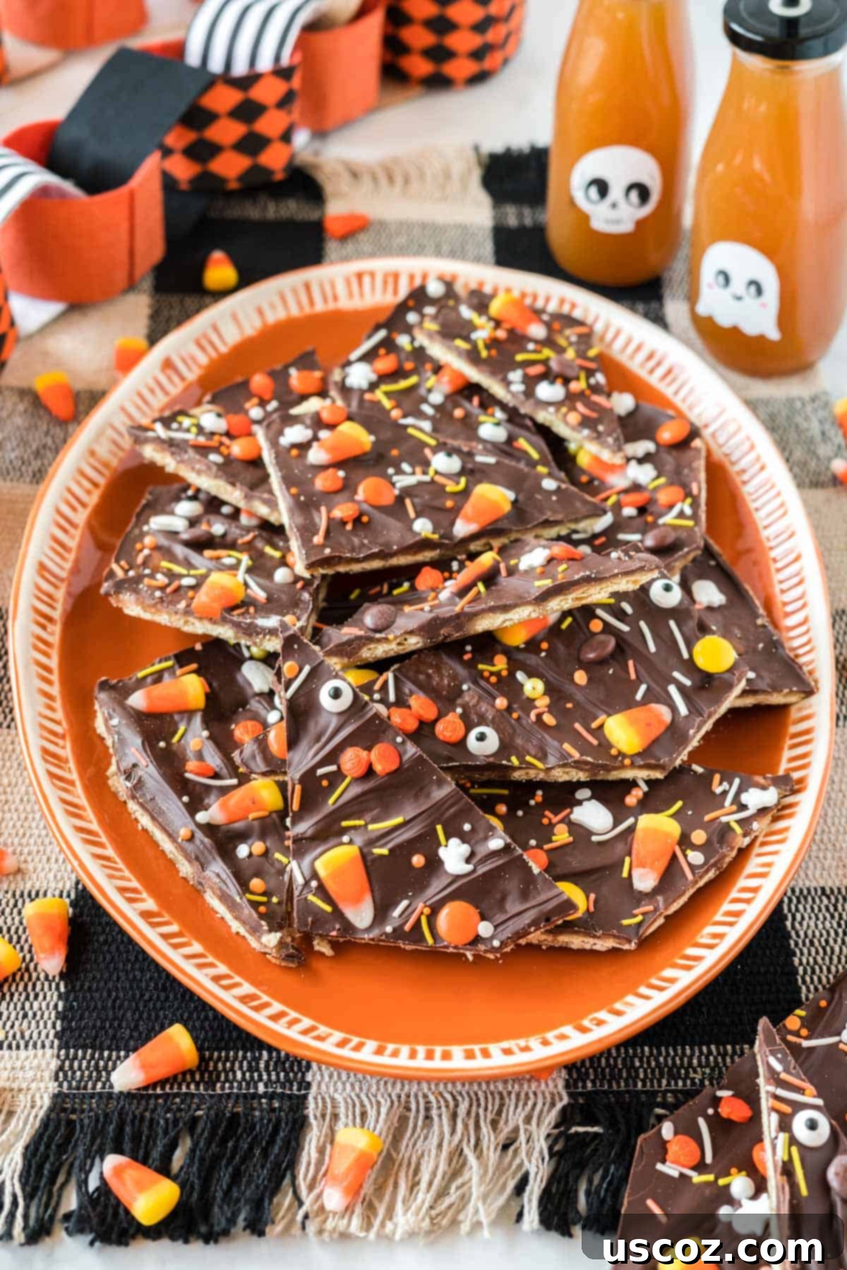 Spooky Halloween Crack 12 Halloween crack candy displayed on an orange serving plate, showing off the colorful toppings.
