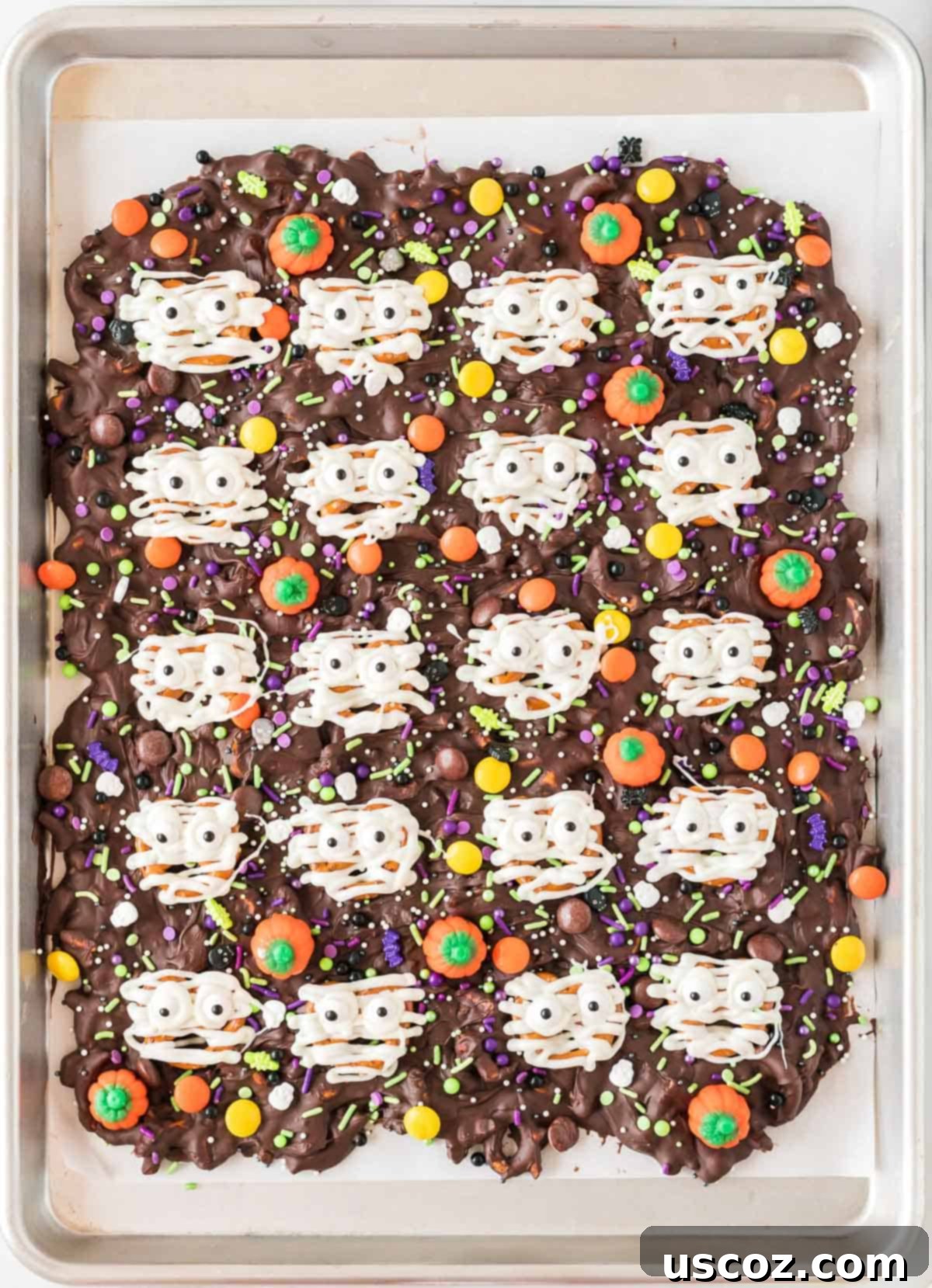 Monster Mash Bark 13 close-up of halloween bark with mummy pretzels and other candies